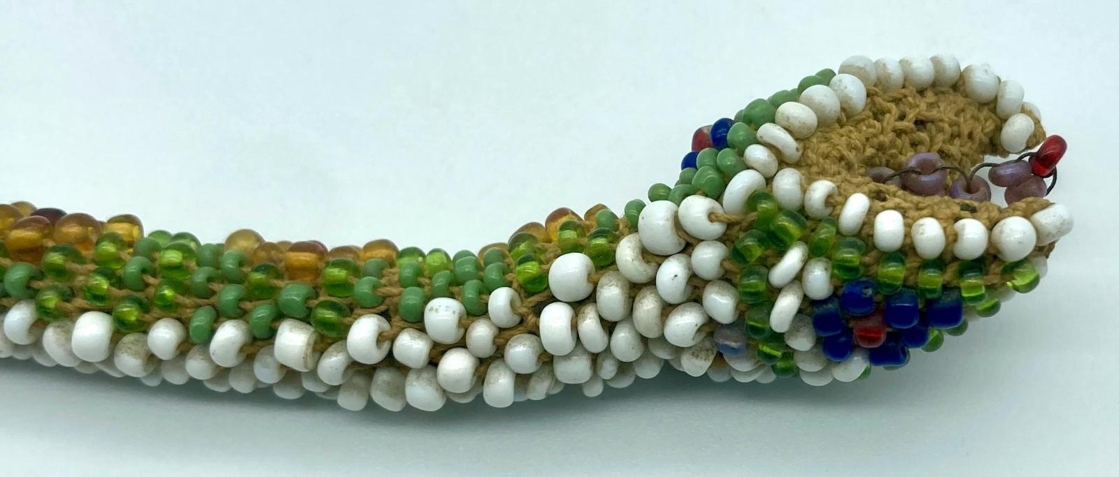 Underside of head of small Ottoman prisoner of war beadwork snake