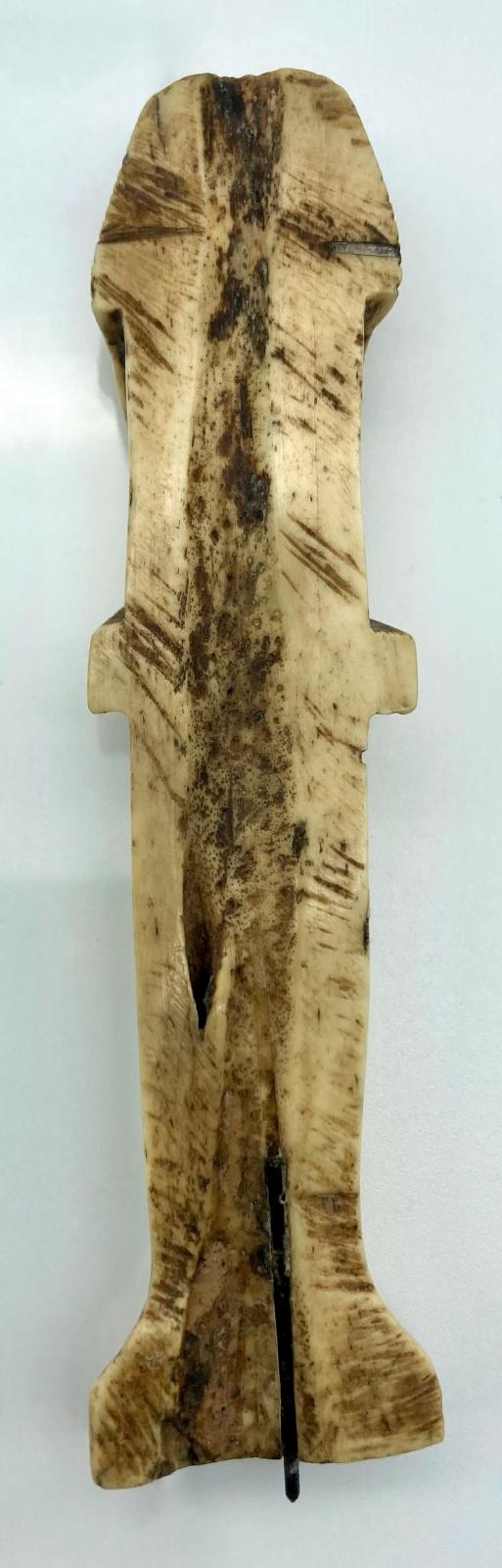 Reverse of carved camel bone in the form of an Egyptian shabti