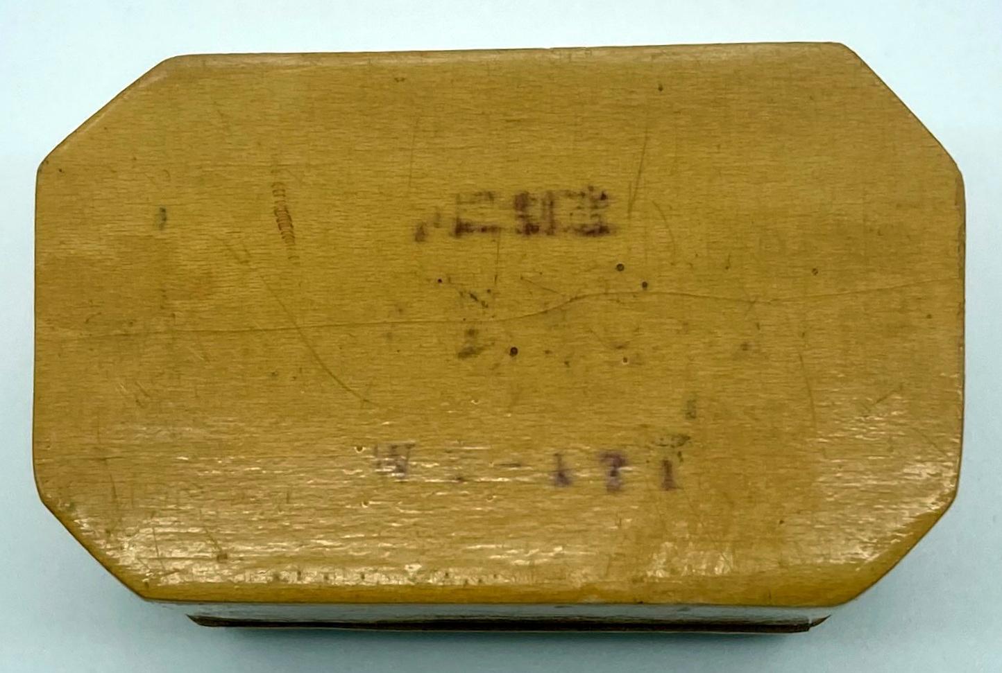 Lacquered timber box with bird motif - view of base from above