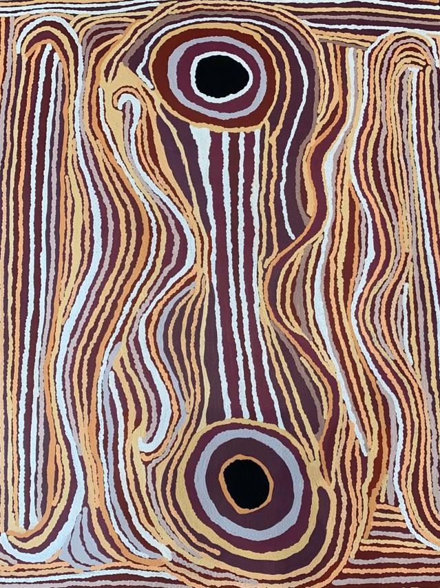 Aboriginal painting with two circles and lines of orange, shades of purple and white