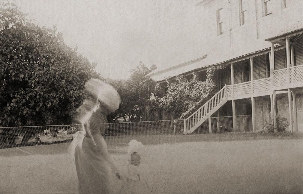 Child And Women On A Tennis Court