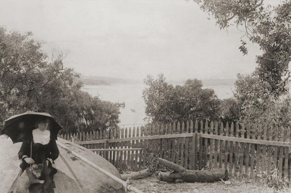 Woman Seated On Well Cover