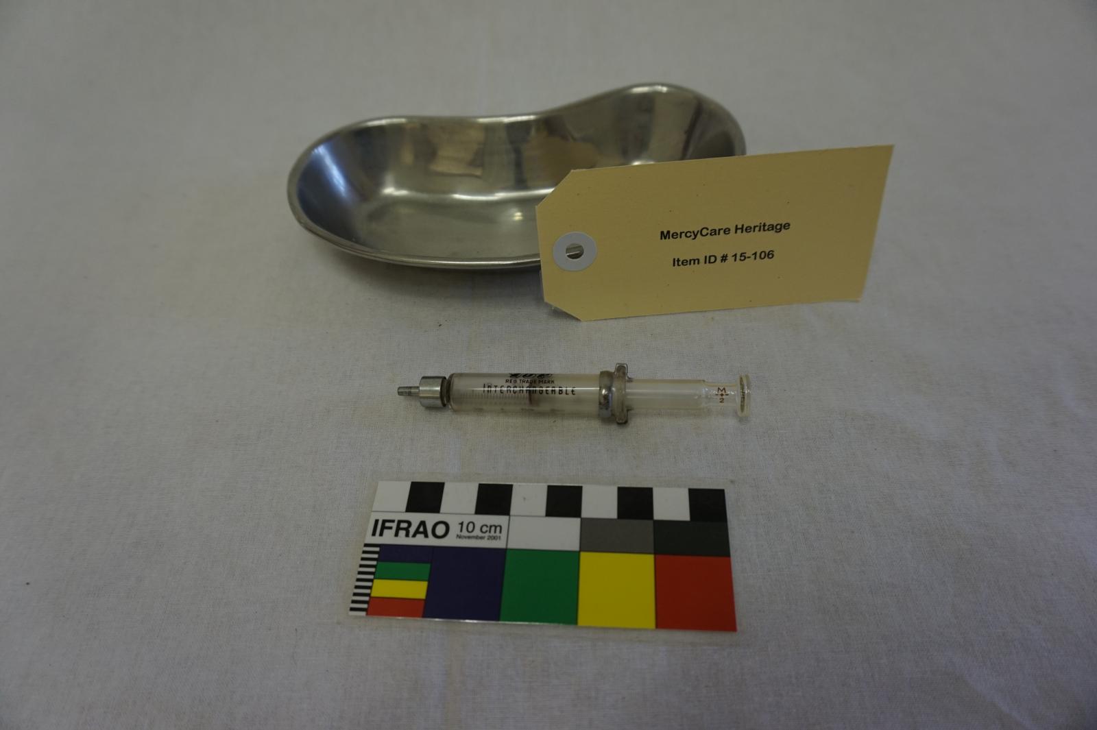 Metal Dish and Syringe