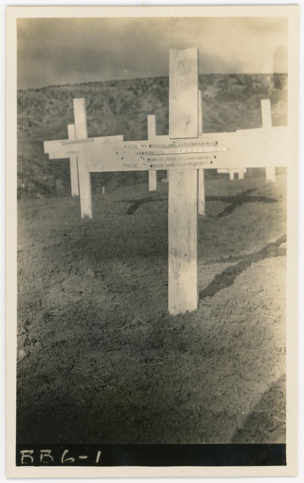 B&W photographic postcard of Pte James DENNEY's gravesite, (foreground).