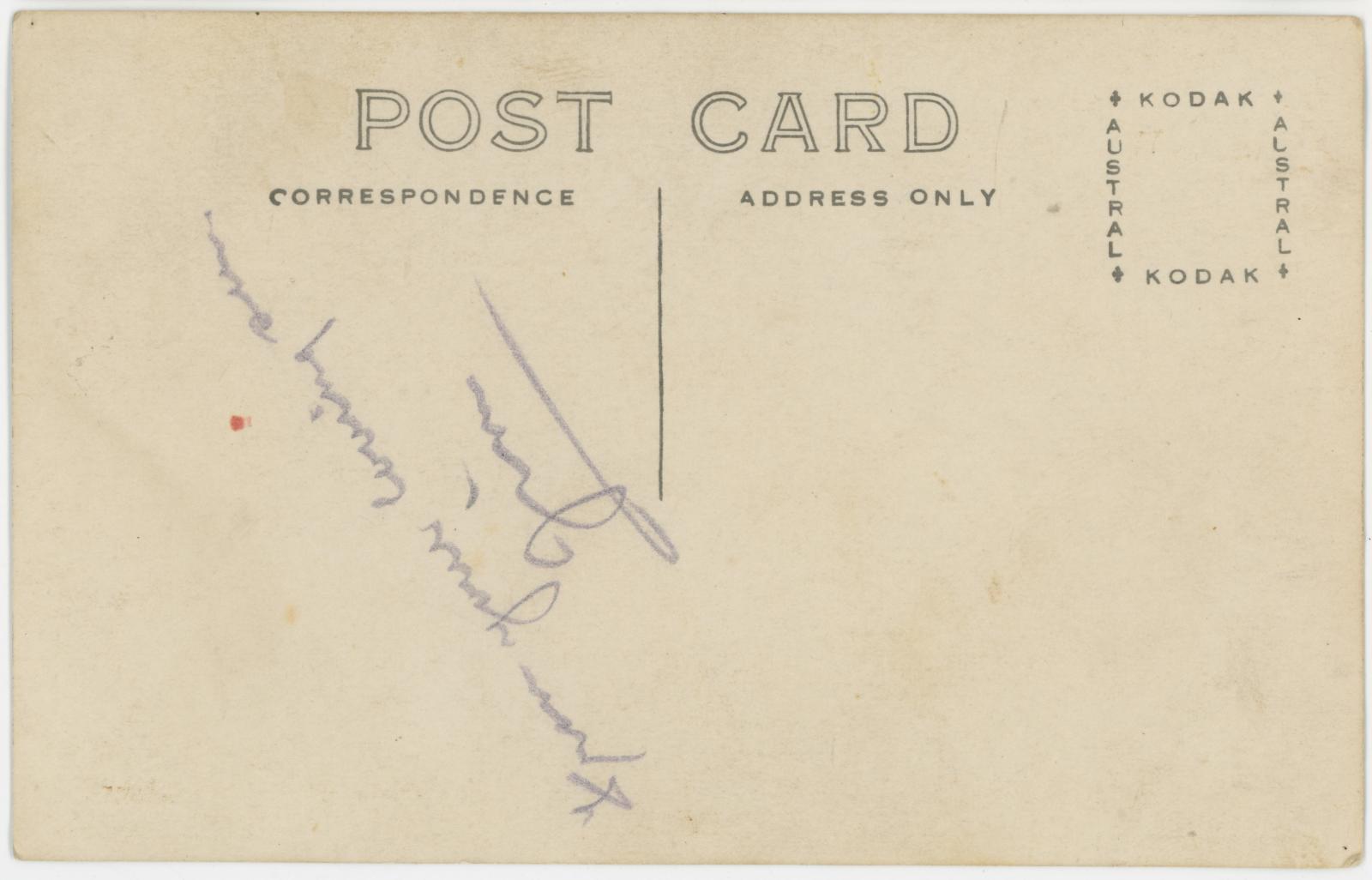 Rear view of postcard showing handwriting.