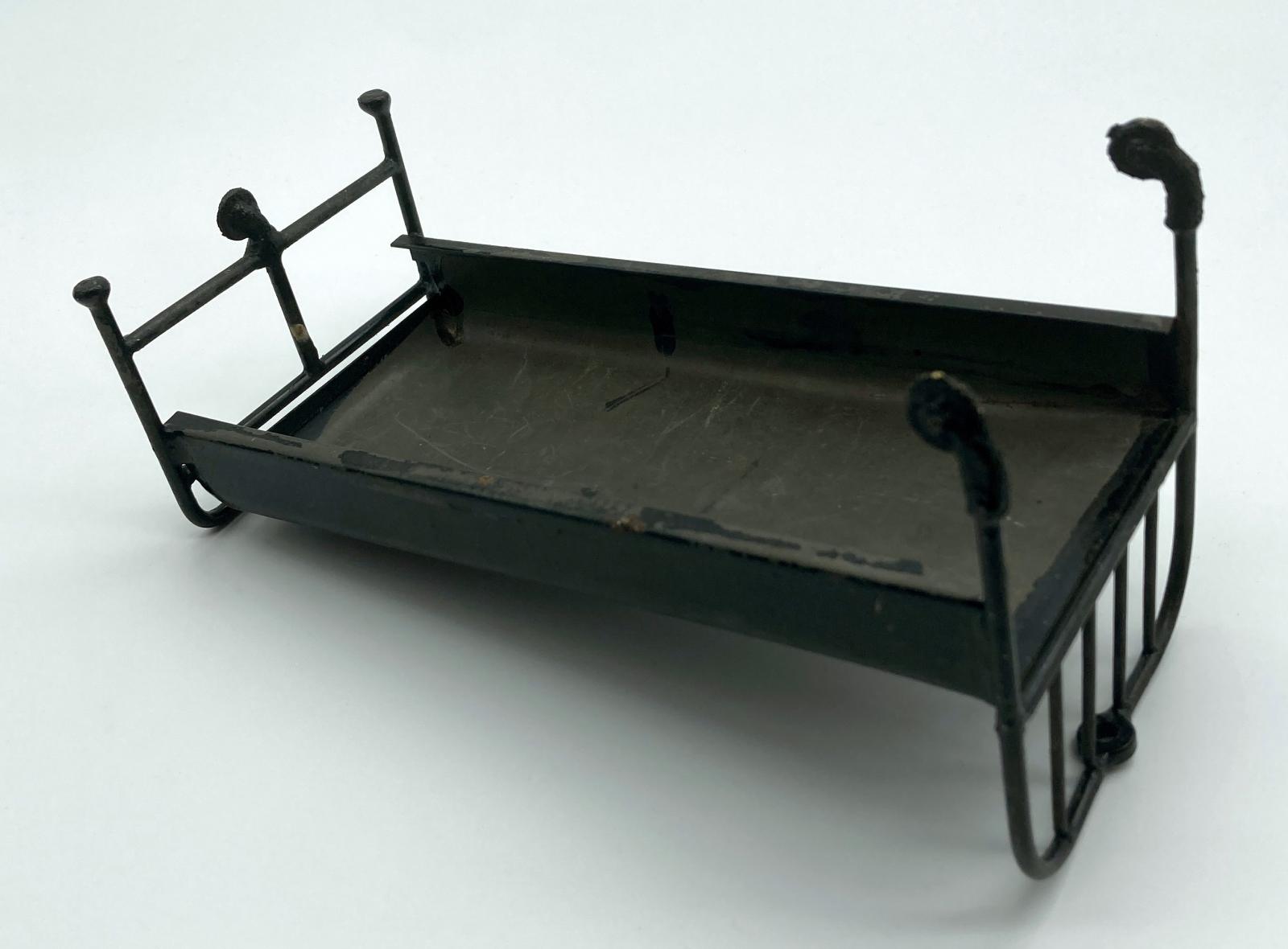 Miniature hospital bed made by convalescent soldier - view of underside