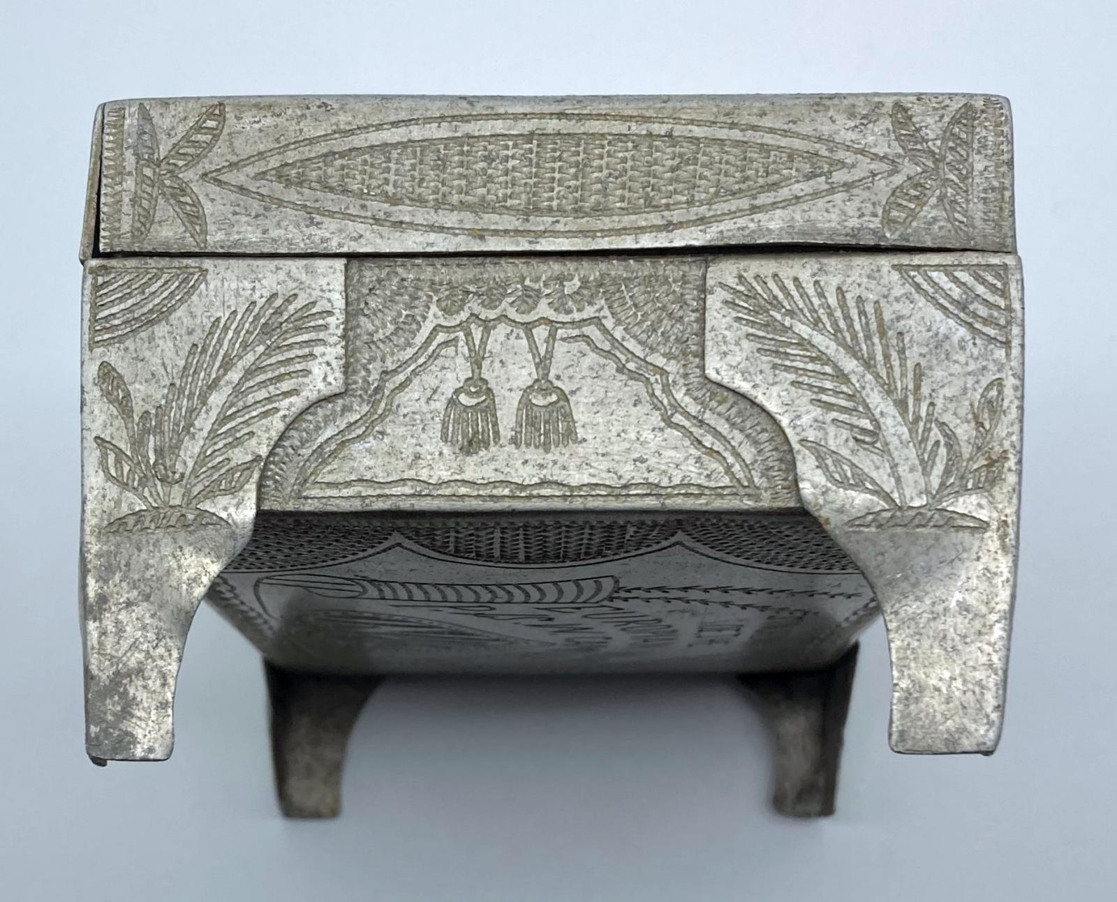 Top view of one side of Ottoman POW trench art cigarette box