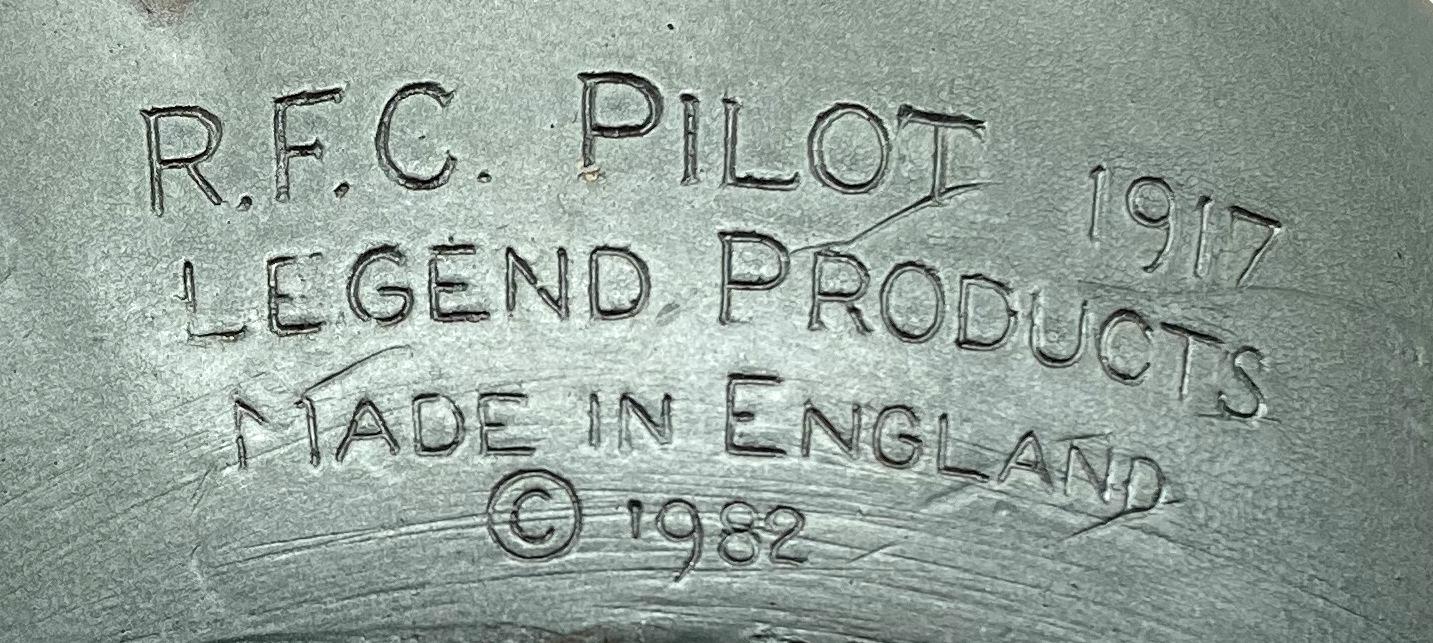 Close up of maker's details on chalkware wall hanging