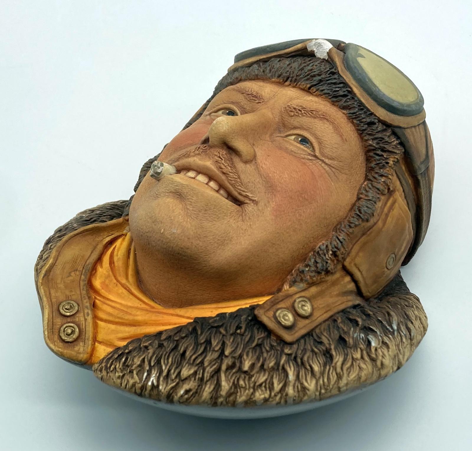 Other oblique view of painted chalkware wall hanging depicting Royal Flying Corps pilot 1917