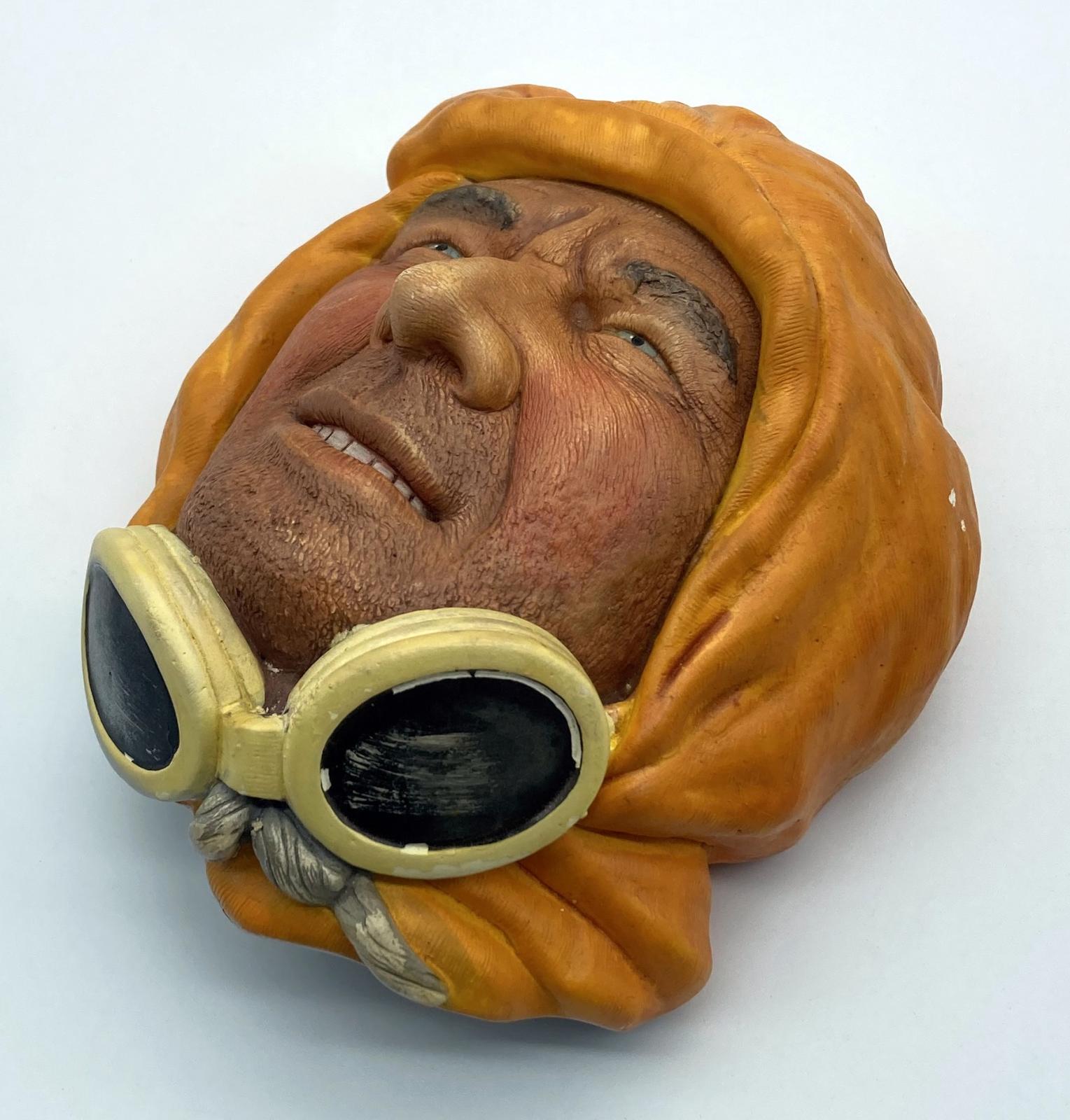 Other oblique view of painted chalkware wall hanging depicting an Arctic explorer