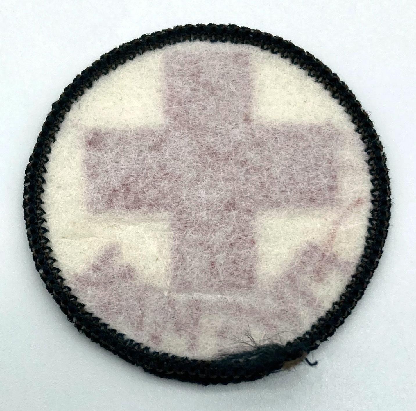 Reverse of cloth patch worn by Red Cross Fireman