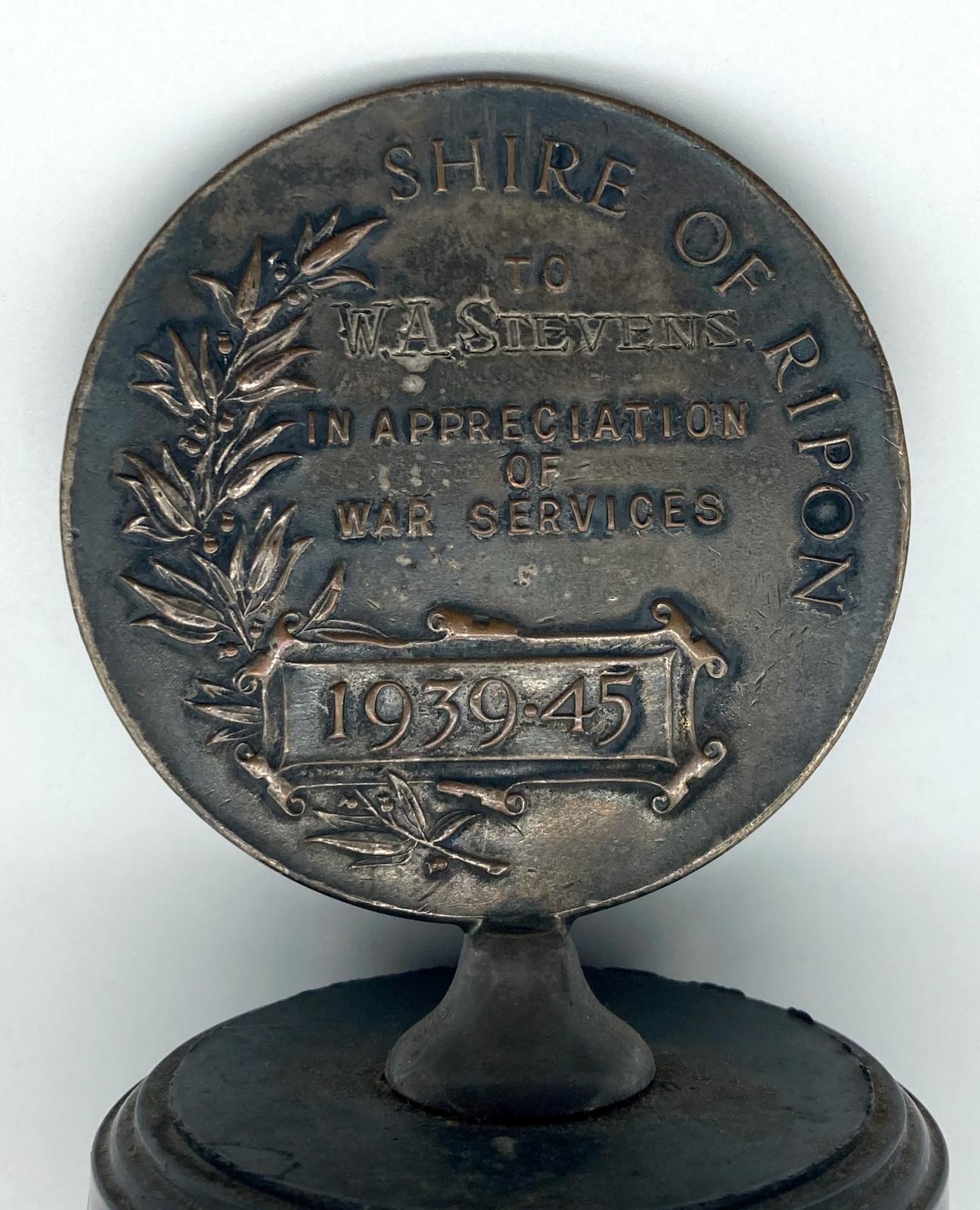 Close up of medallion and inscription