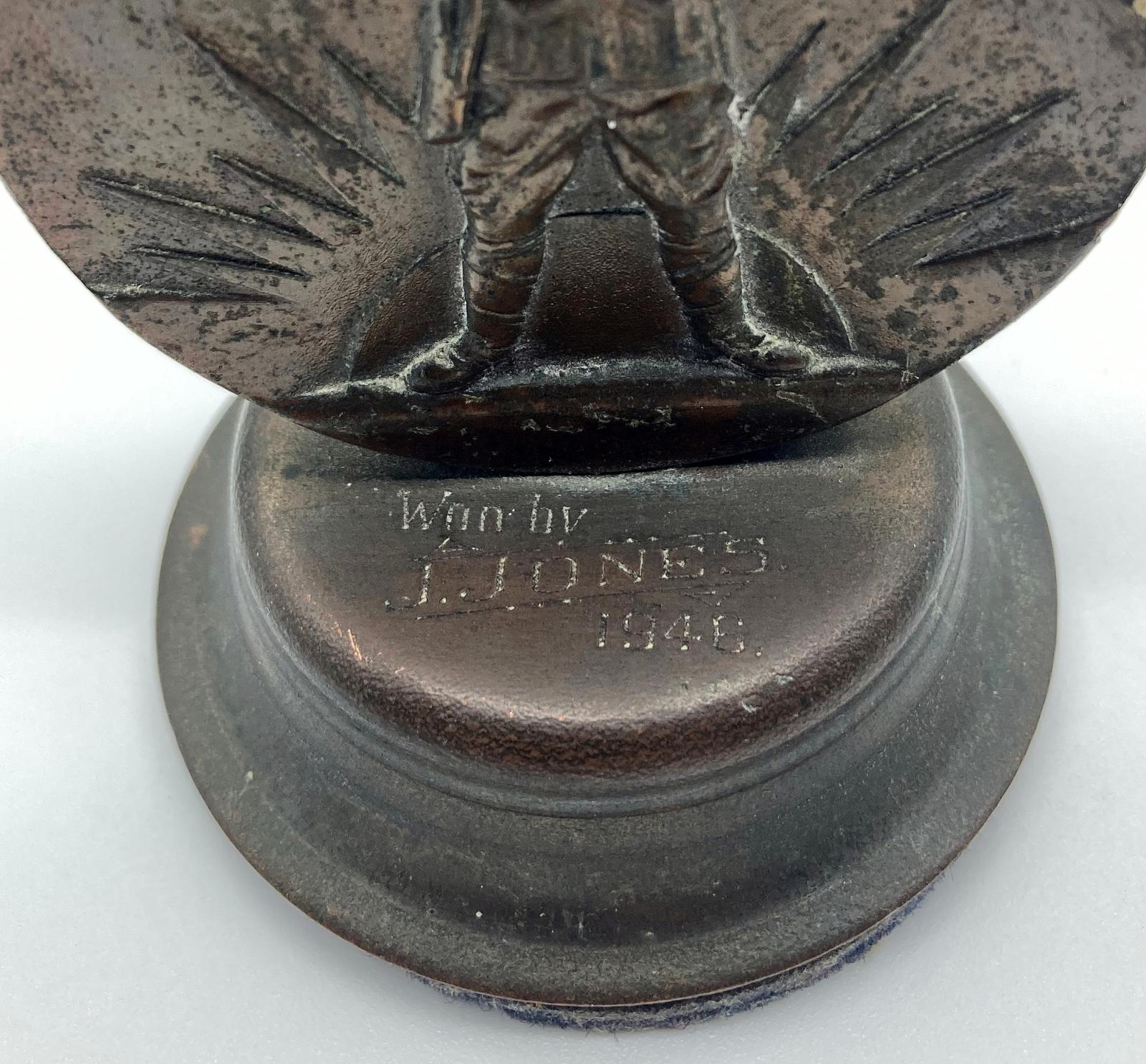 Close-up of Victorian Golf Association War Medallion showing inscription