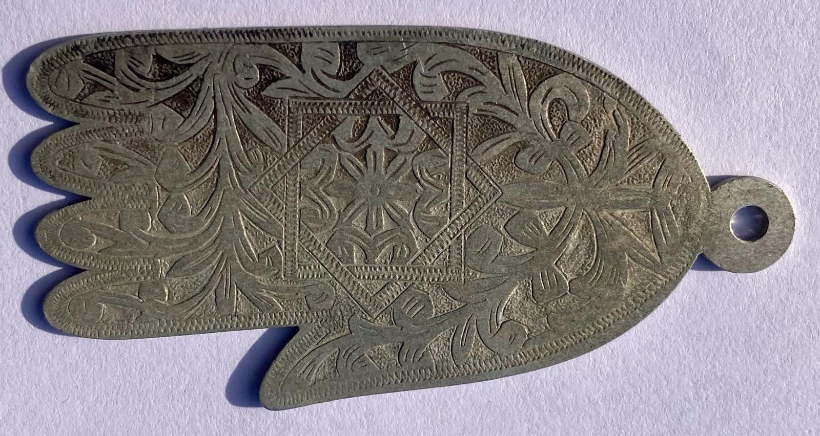 Hamsa (Hand of Fatima) amulet showing decoration
