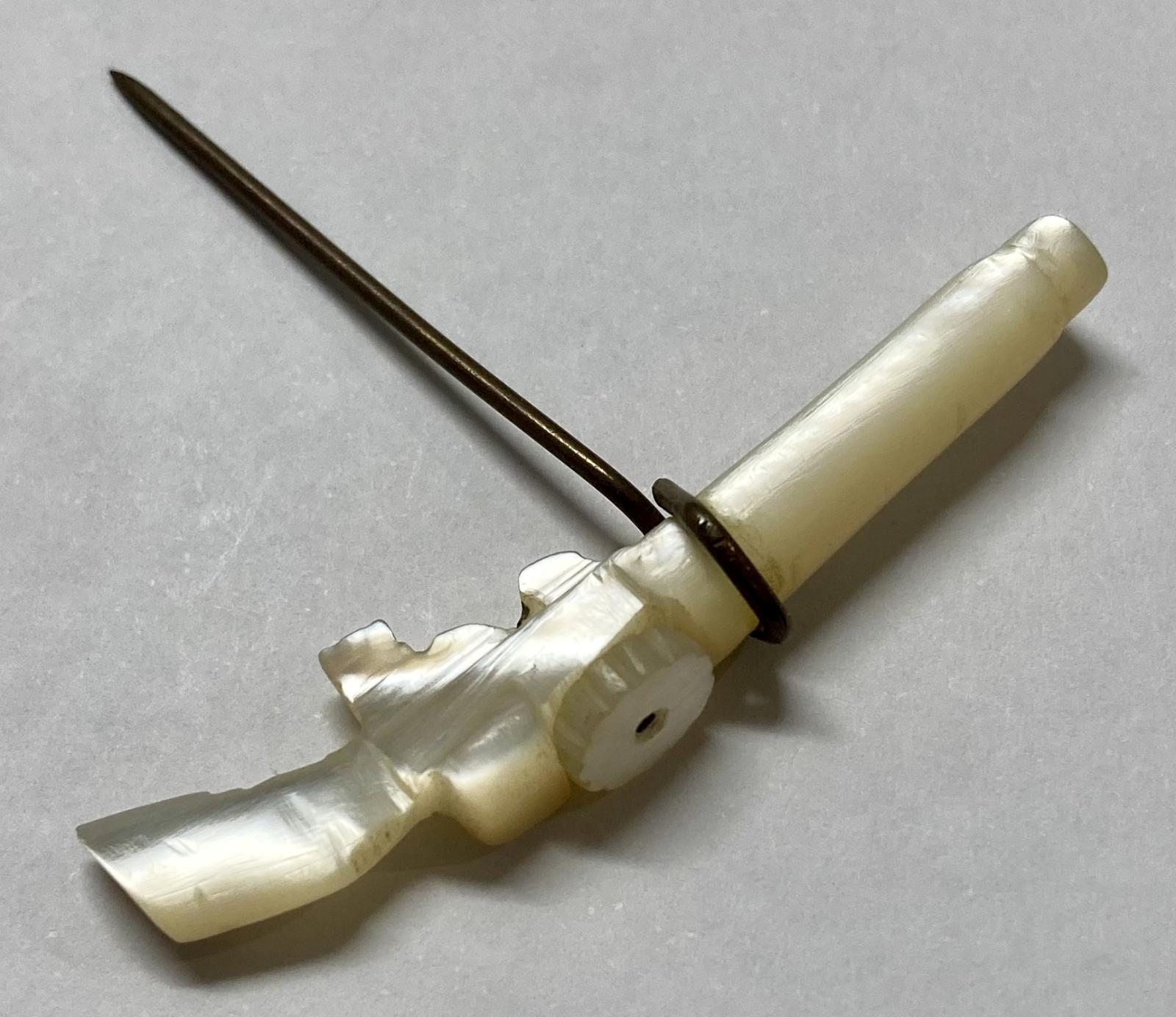 WWI era Mother of Pearl Lewis Gun pin - oblique view 