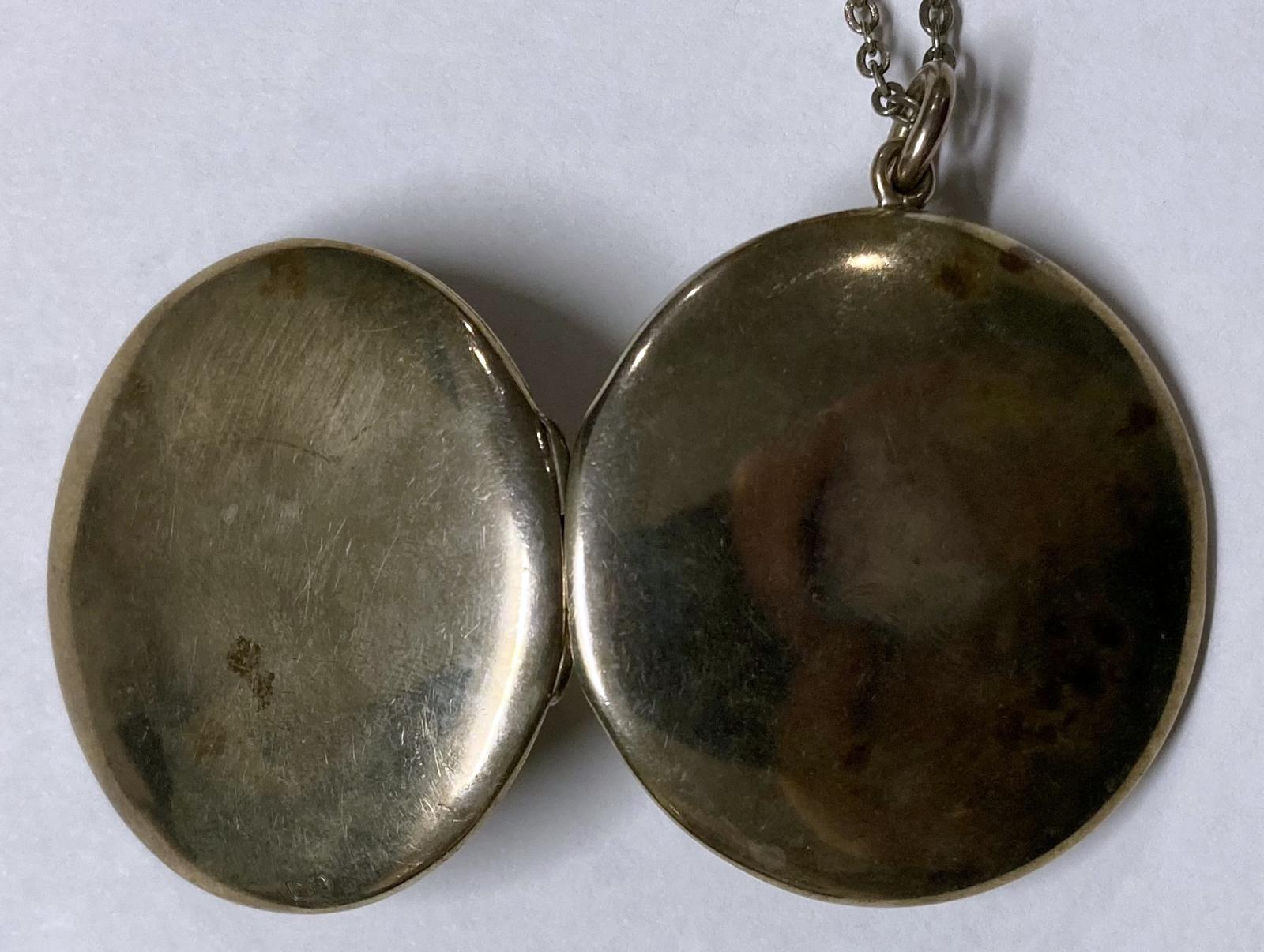 Outside of WWI silver locket - open