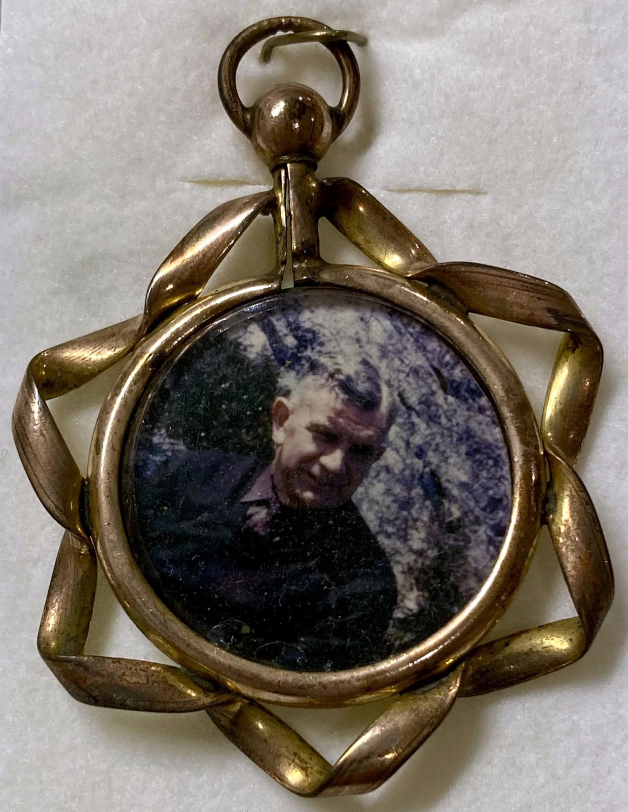Reverse of WWI era double-sided pendant locket featuring soldier as an older man