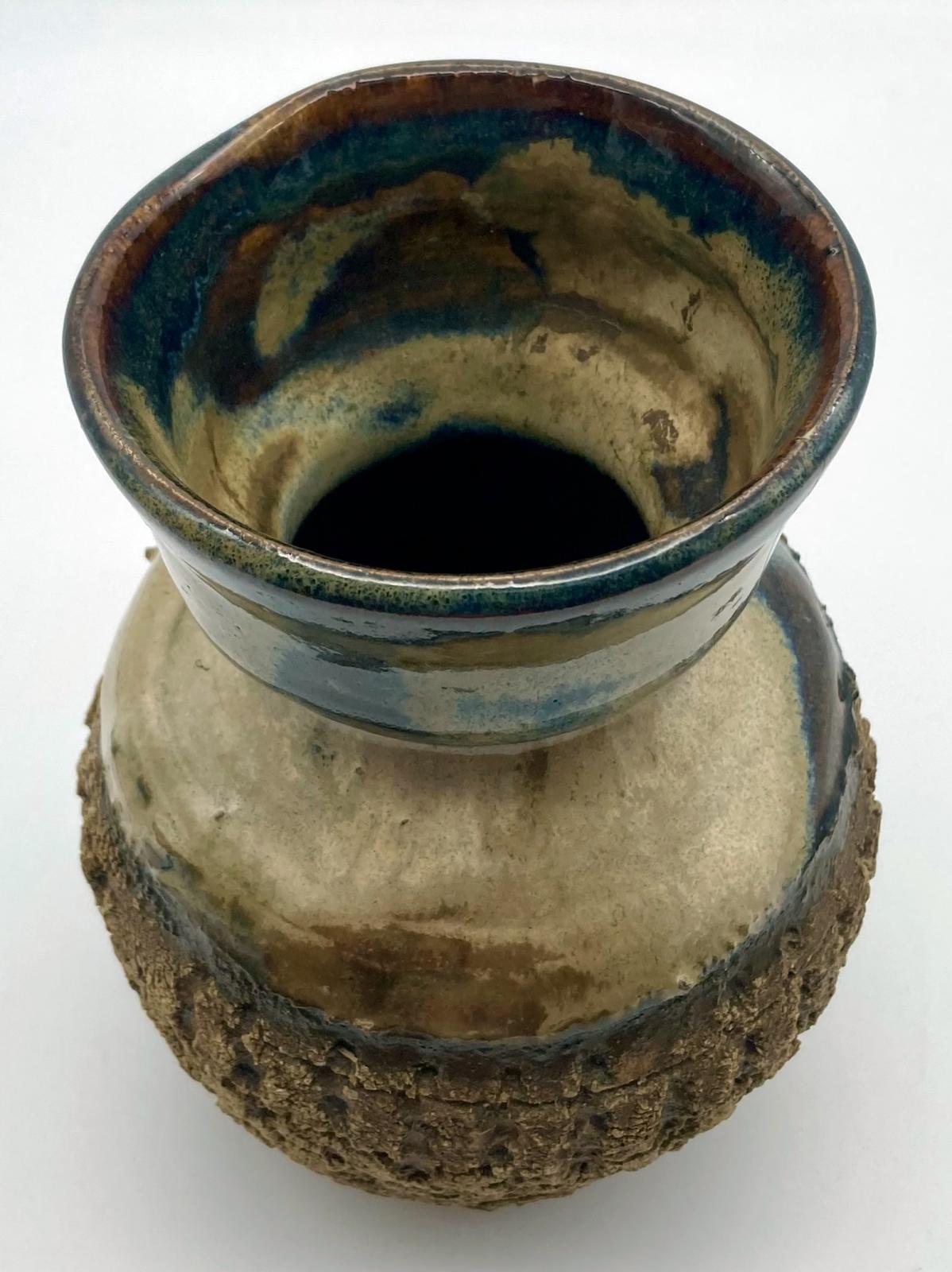 Top view of bark pottery vase made by blinded potter, Bill Reid