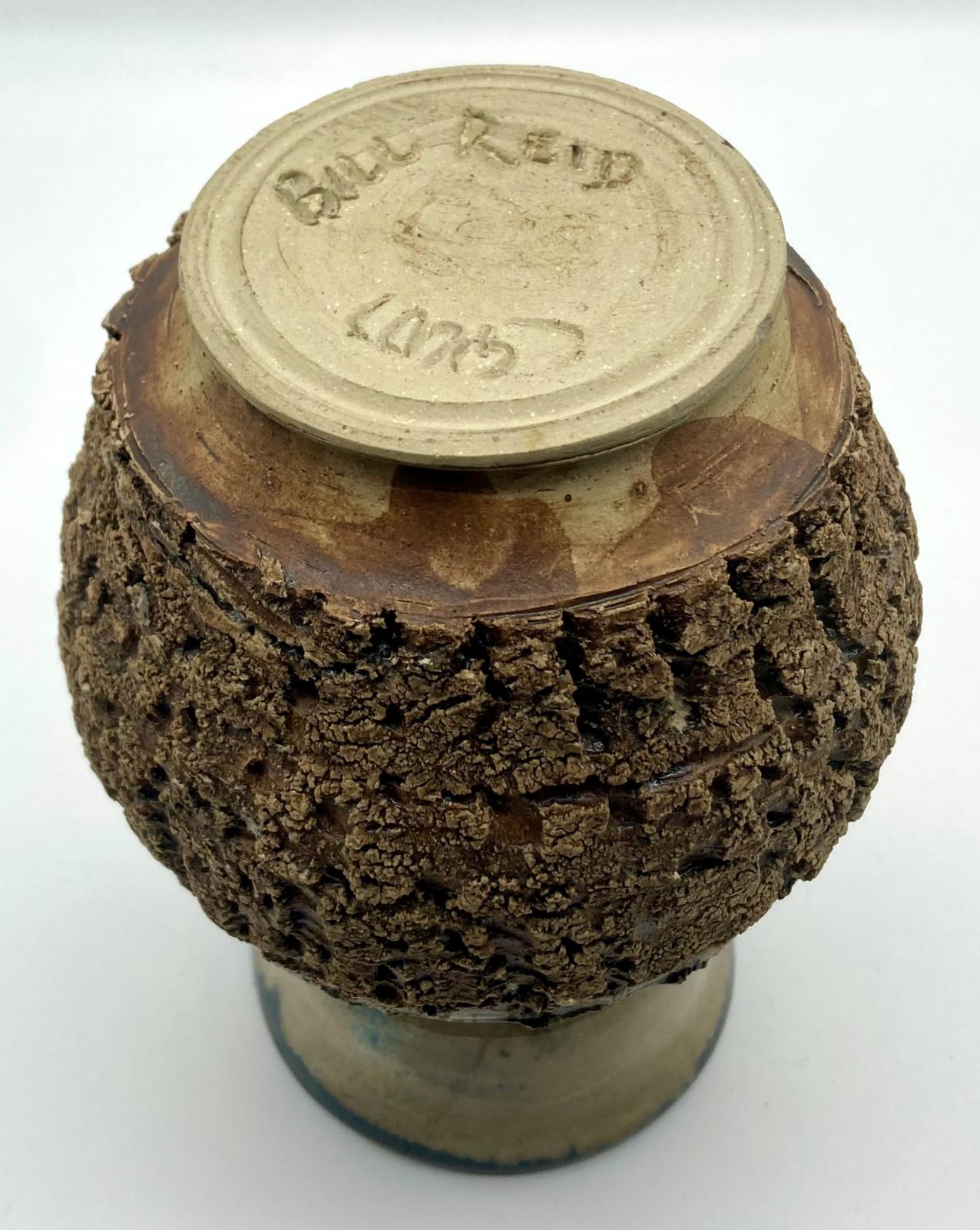 Base view of bark pottery vase made by blinded potter, Bill Reid