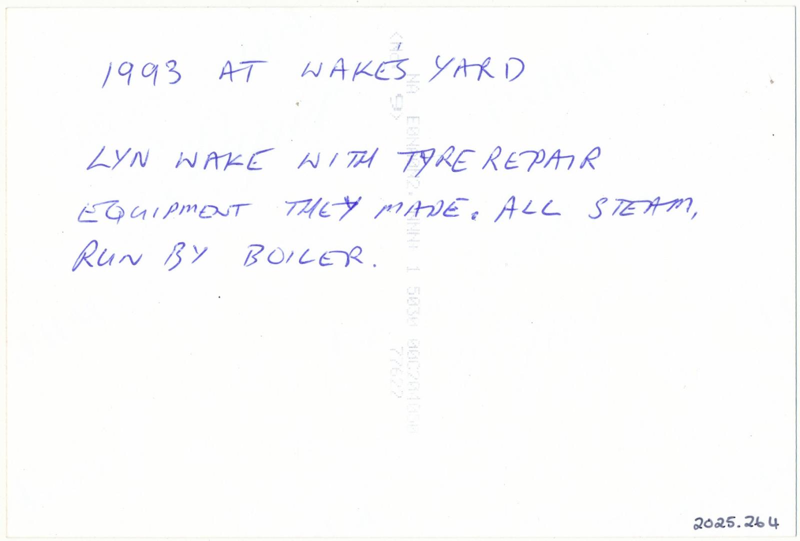 Back of photograph of Lindsay Wake with Tyre Repair Equipment