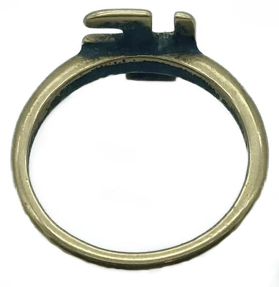 Reverse of WWI era gold ring featuring good luck symbol
