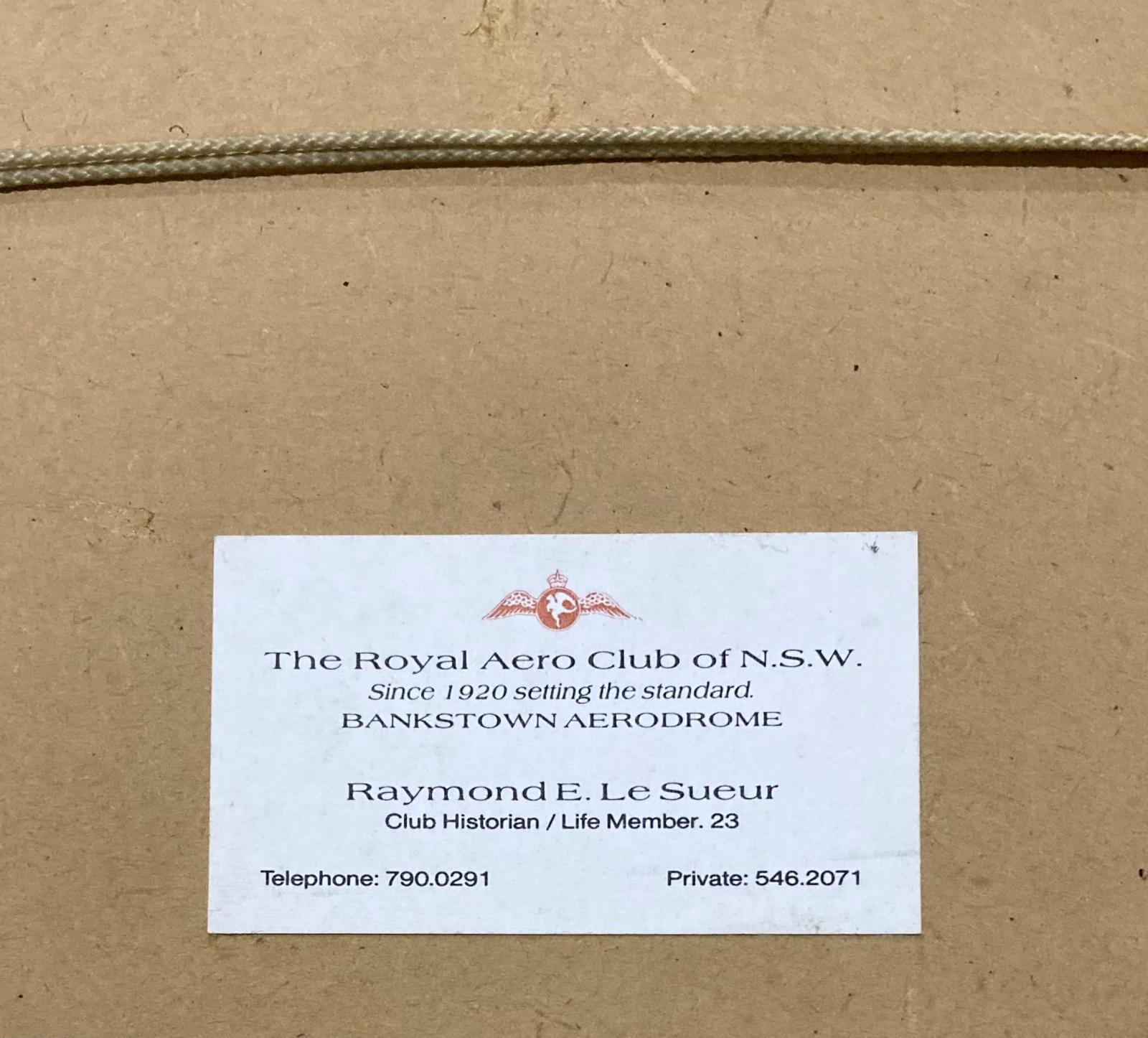 Close up of business card on reverse of framed photograph of aviatrix Jean Batten