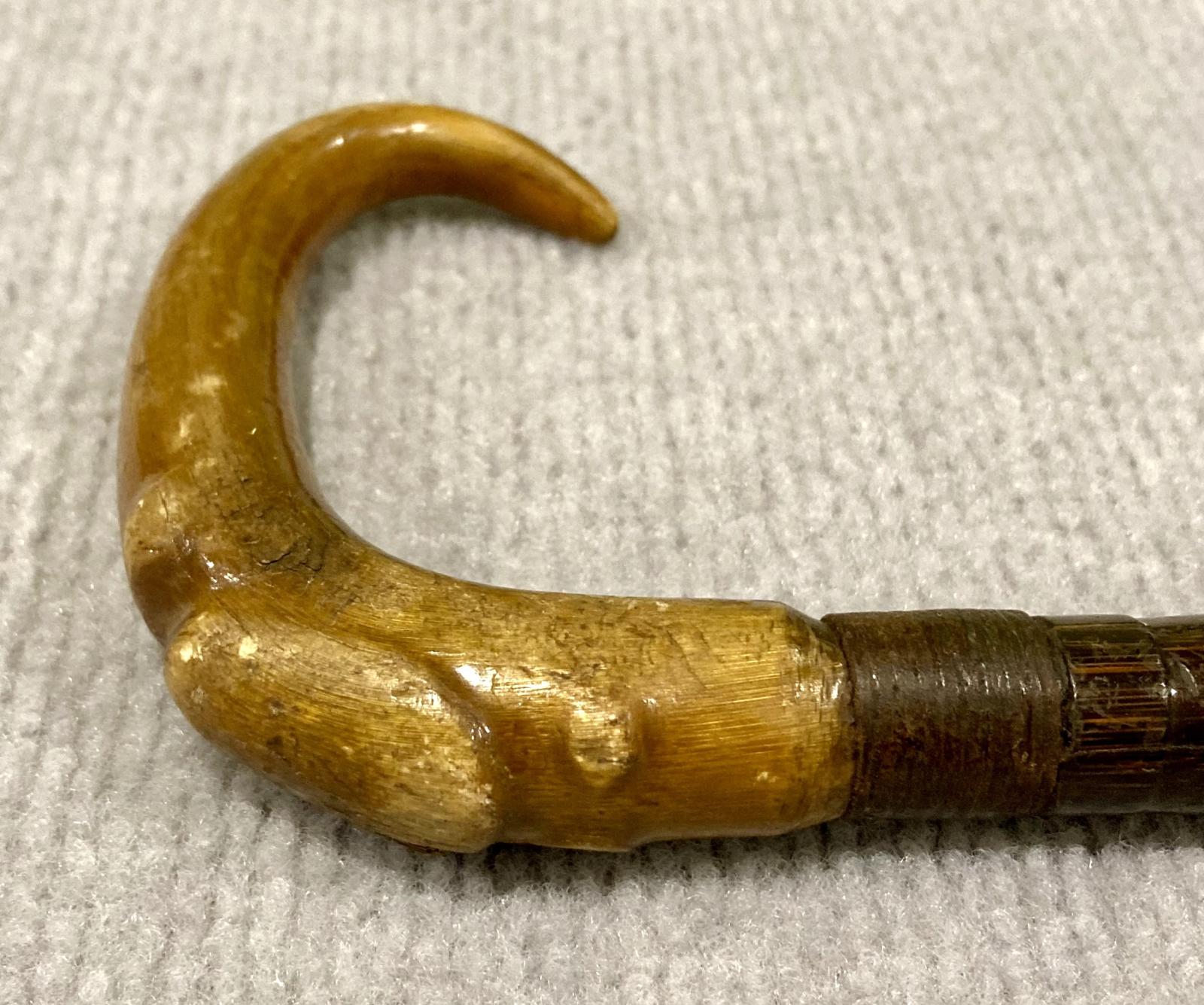 Close-up of other side of walking stick handle