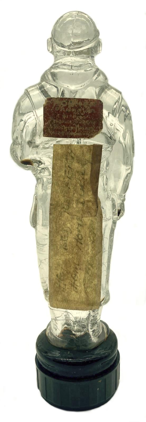 Glass figurine of pilot - view from back