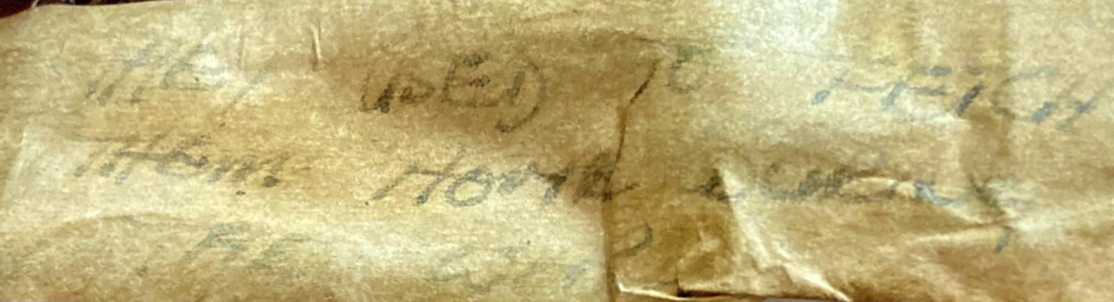 Writing on reverse of glass figurine of pilot
