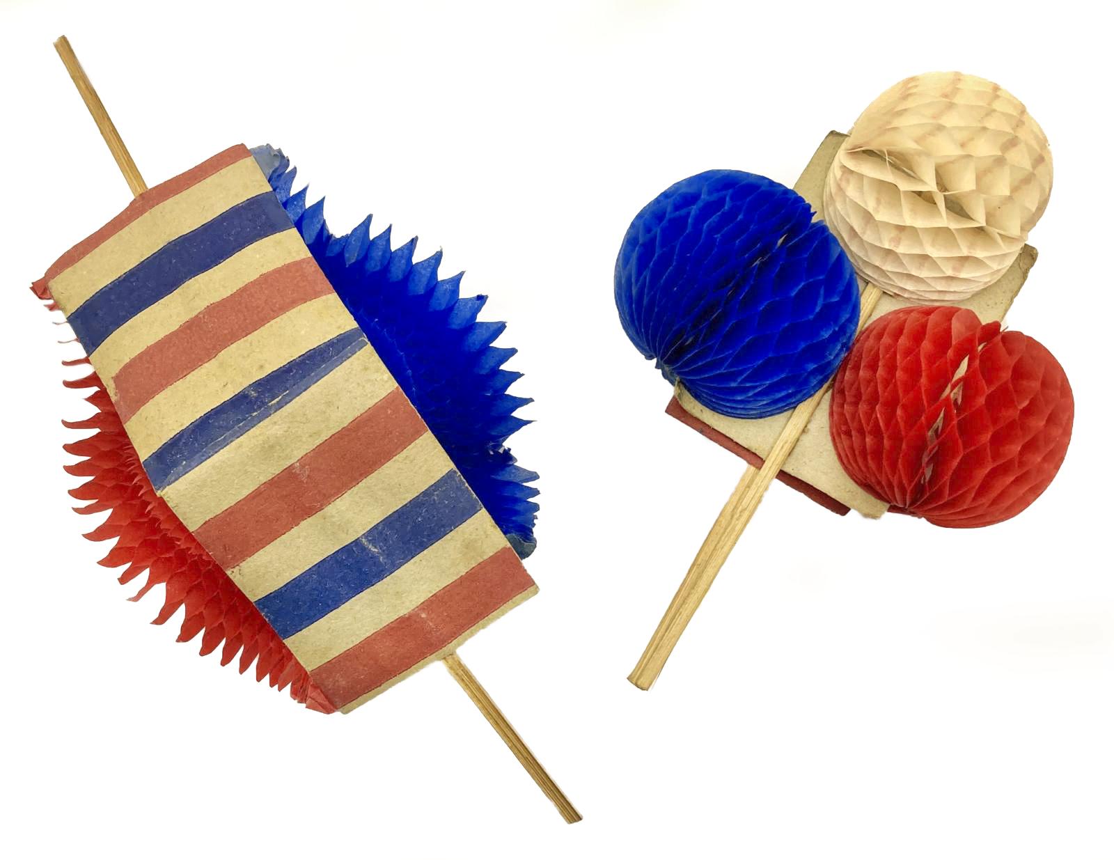 WWI era patriotic fold-out honeycomb balls, showing one opening and the other fully open