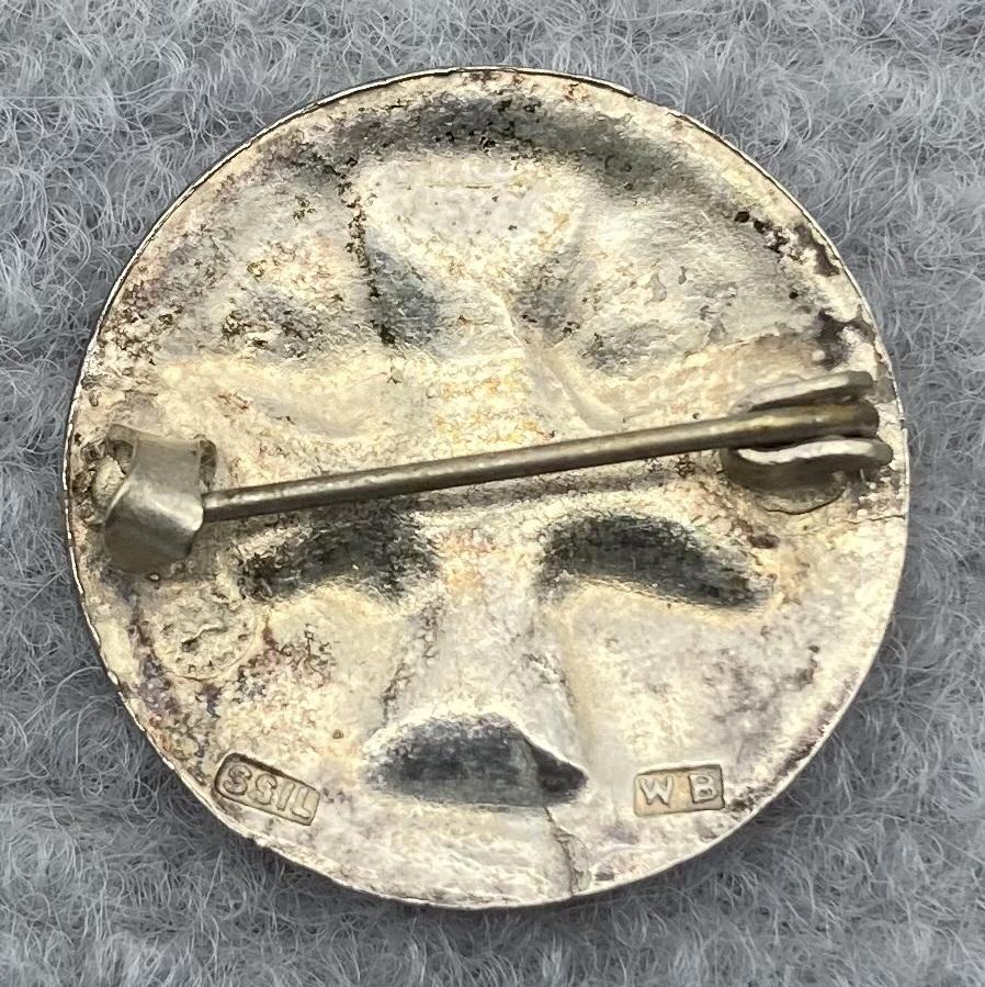 Reverse of Queensland Ambulance Transport Brigade (Q.A.T.B.) silver badge