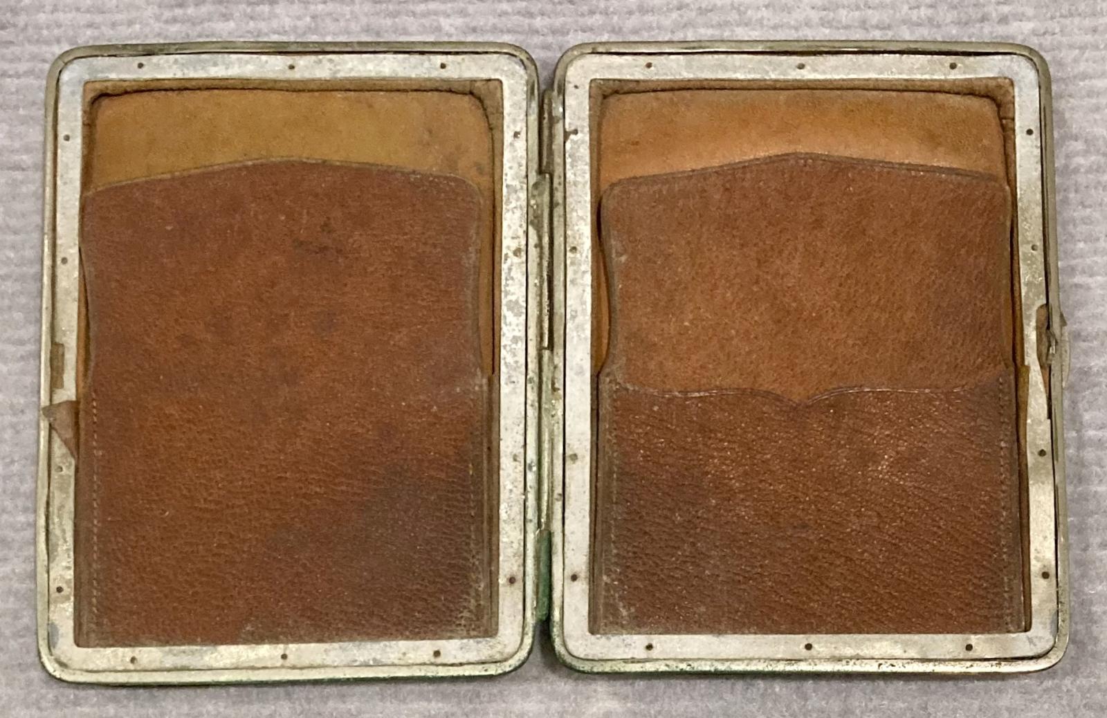 Centre of open, metal-edged leather wallet