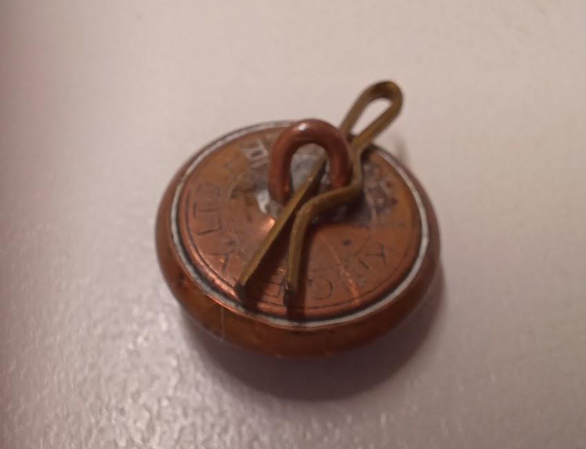 Back of button with shank and clip