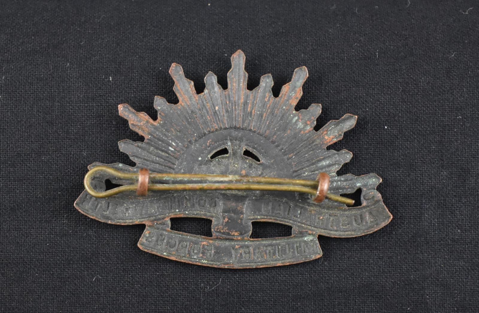 Reverse First World War Rising Sun Hat Badge