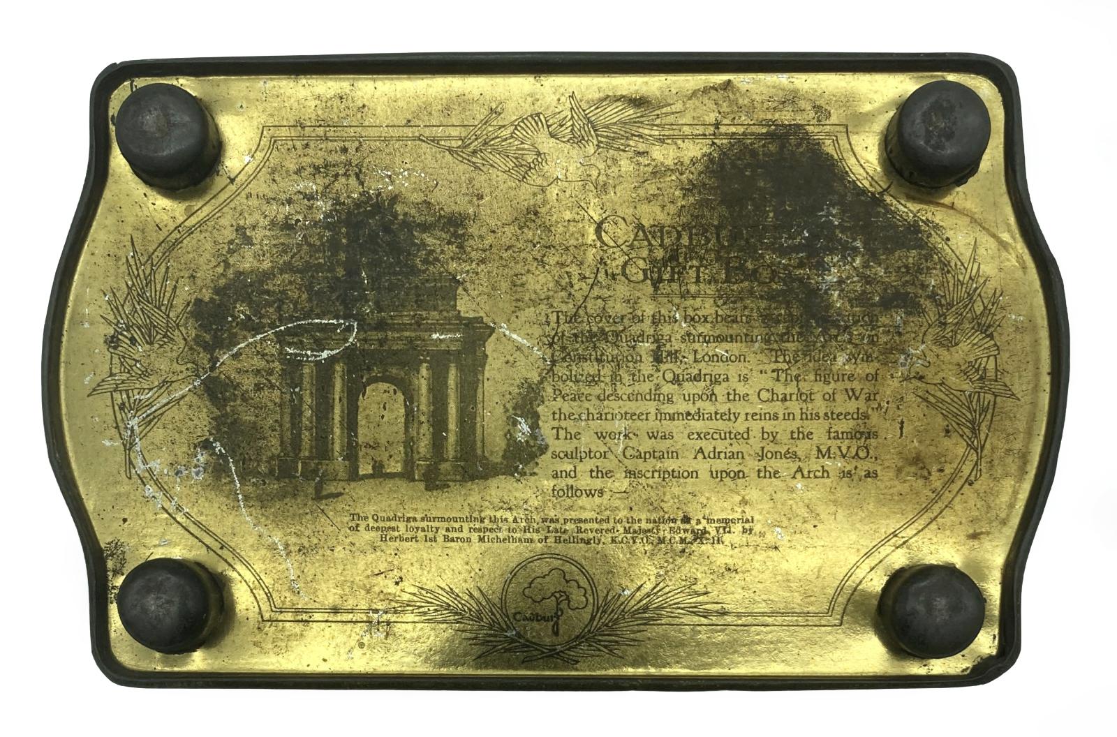 Bottom view of Cadbury tin showing feet and information