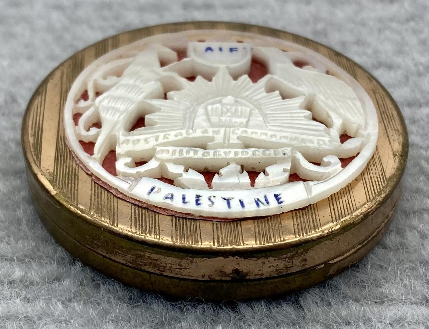 Side view of souvenir powder compact from Palestine