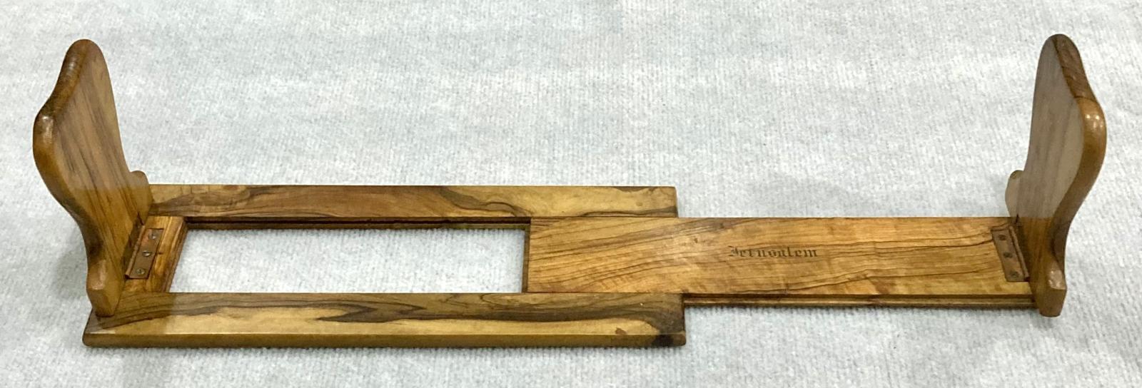 Side view of souvenir olive wood adjustable book shelf with full expansion