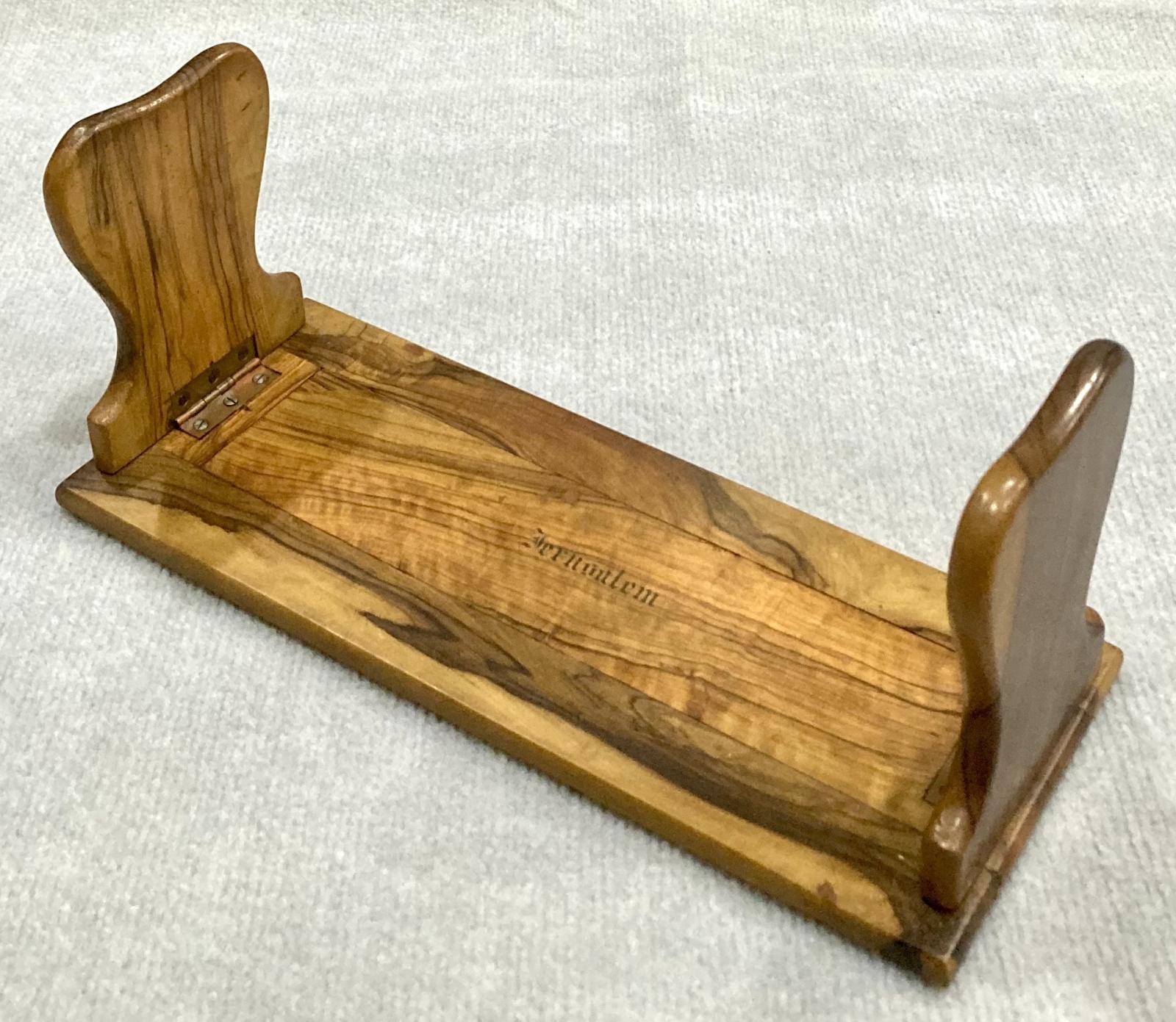Oblique side view of souvenir olive wood adjustable book shelf from Jerusalem