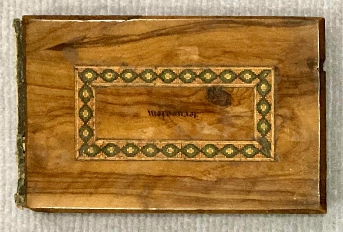 Front of souvenir olive wood album showing 'Jerusalem' upside down