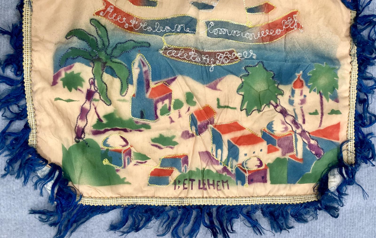 Close up of bottom of souvenir embroidered cushion cover from Bethlehem