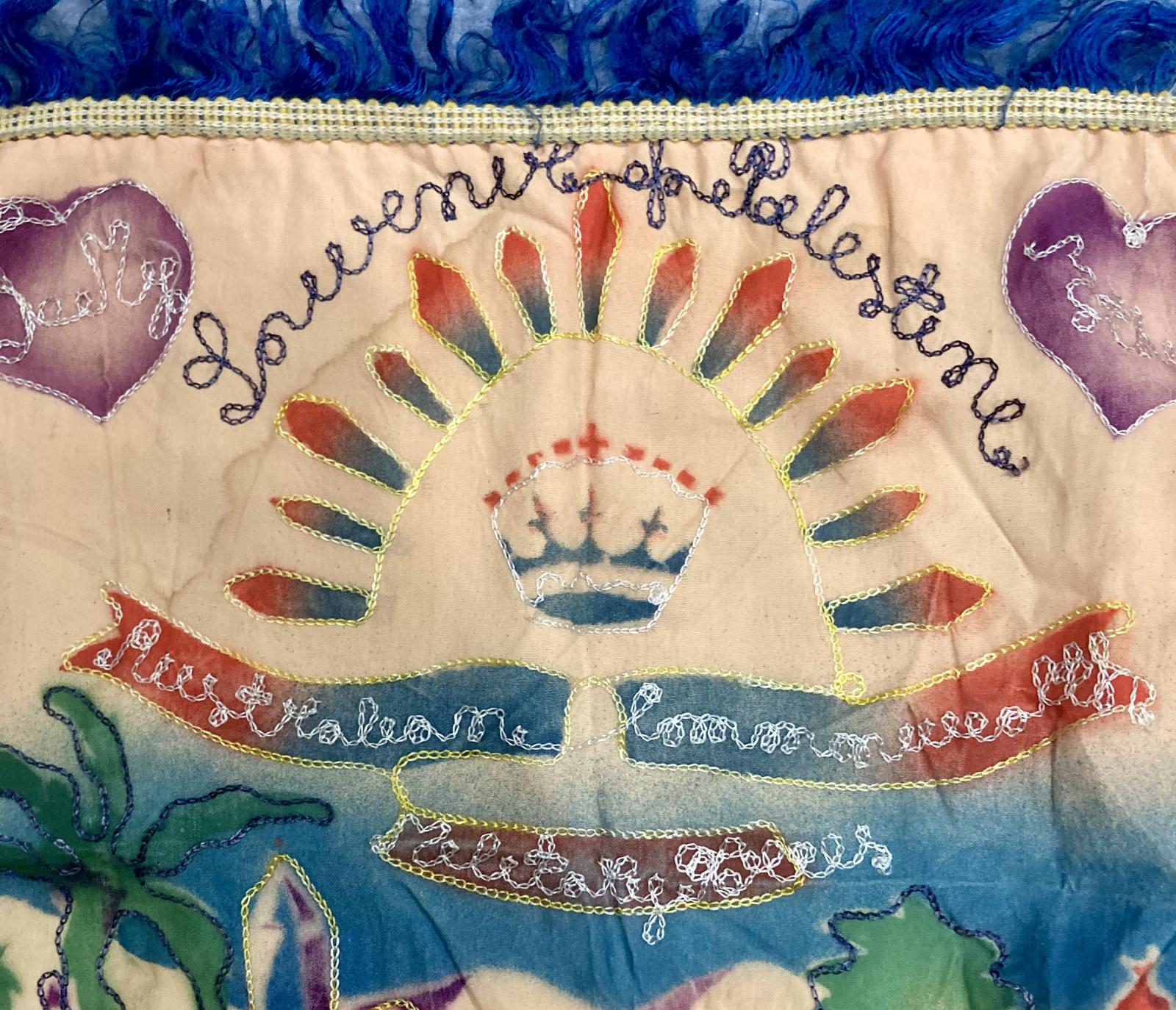 Close up of Australian rising sun badge on embroidered cushion cover