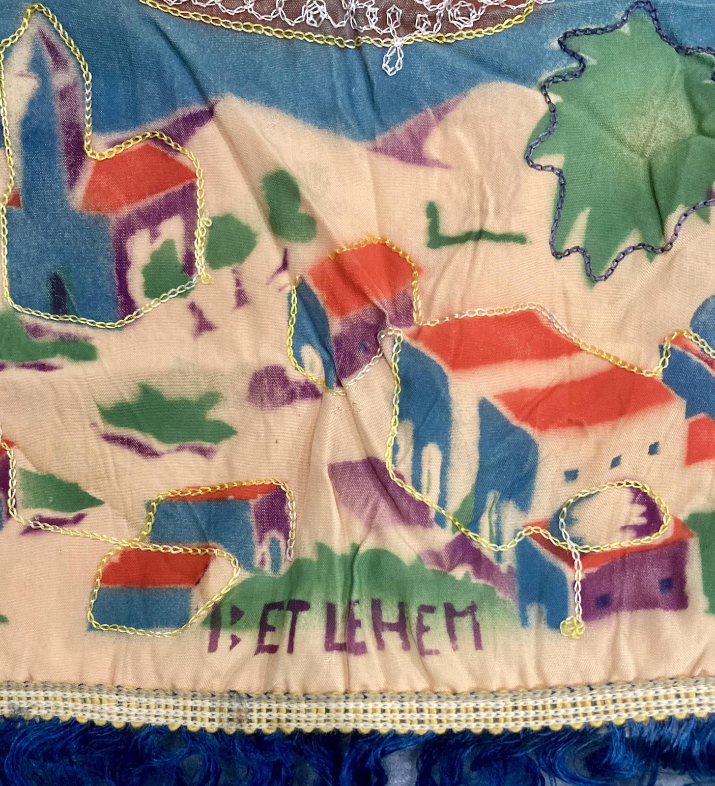 Close up of 'Betlehem' [sic] on embroidered cushion cover