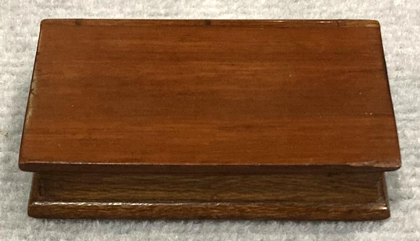 View of book pages of closed souvenir timber book with hidden opening 