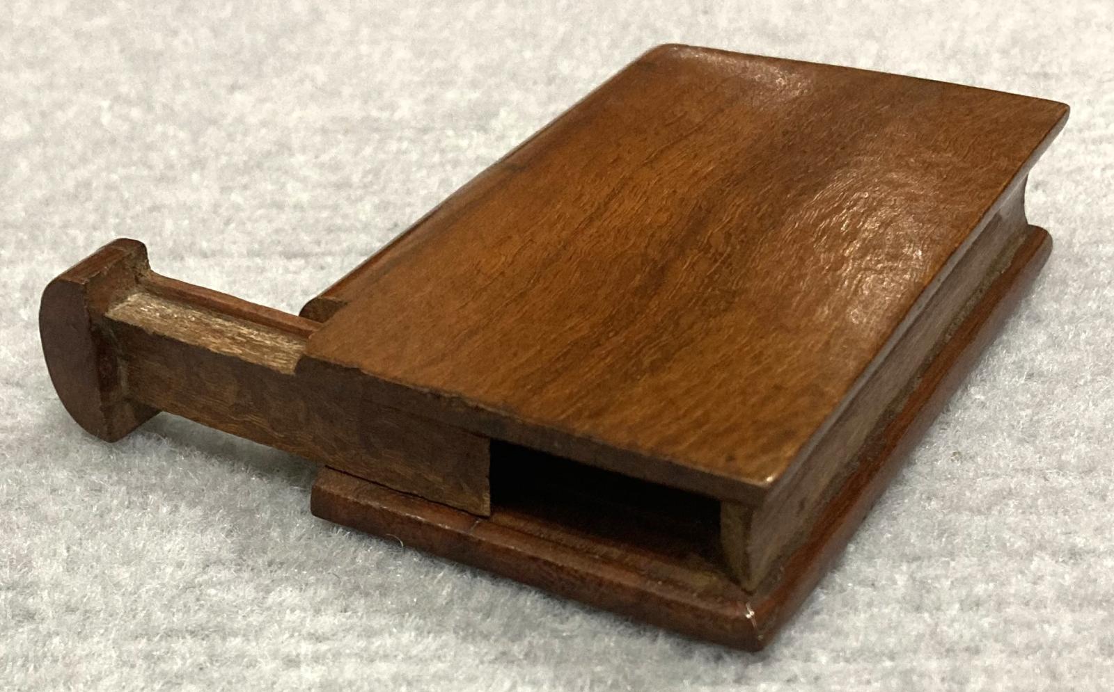 Other oblique view showing open souvenir timber book 