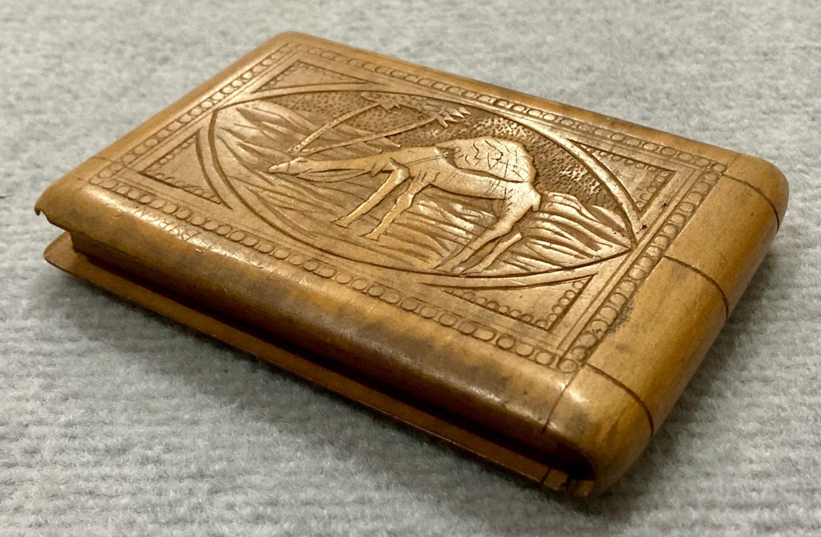Oblique back view of souvenir timber case featuring camel