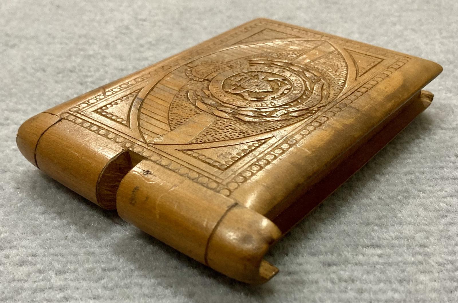 Oblique view of front of timber case showing opening