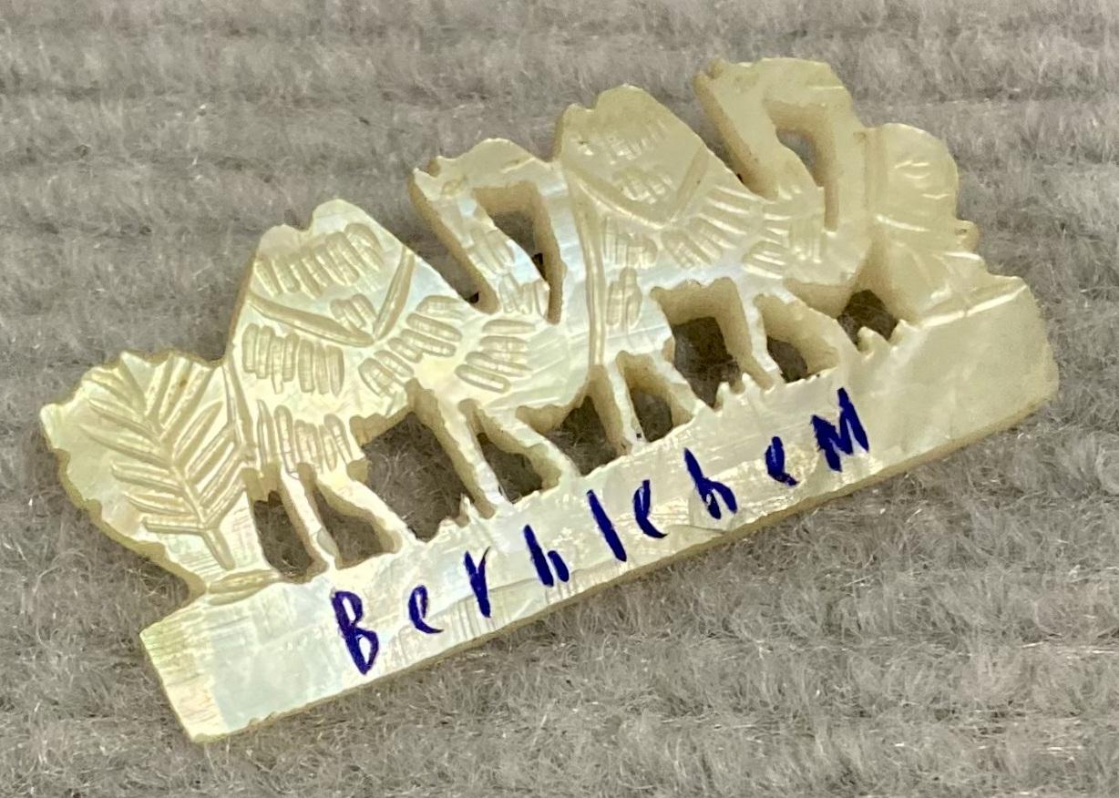 Oblique view of Mother of Pearl camel brooch sent from Bethlehem by Theophilus Thomas Walters