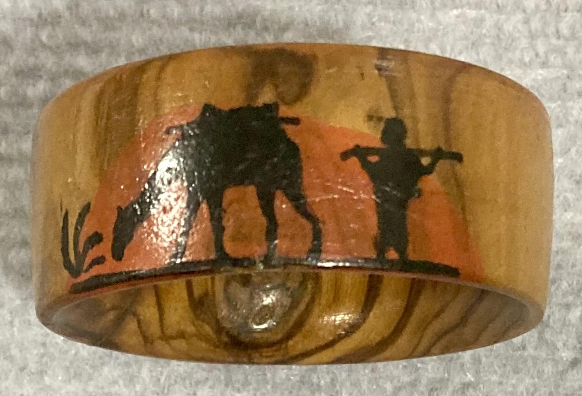 Top view of souvenir olive wood napkin ring from inside jewellery box