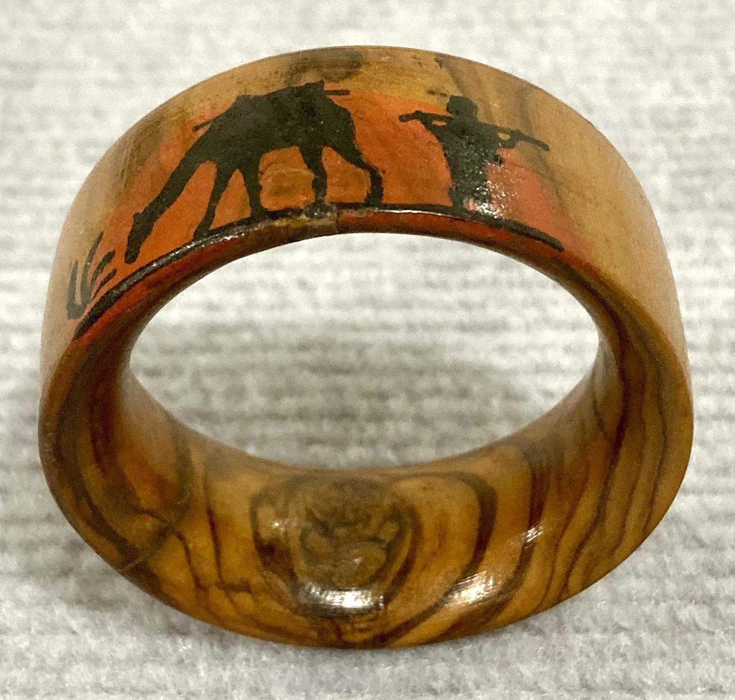 Side view of souvenir olive wood napkin ring from inside jewellery box