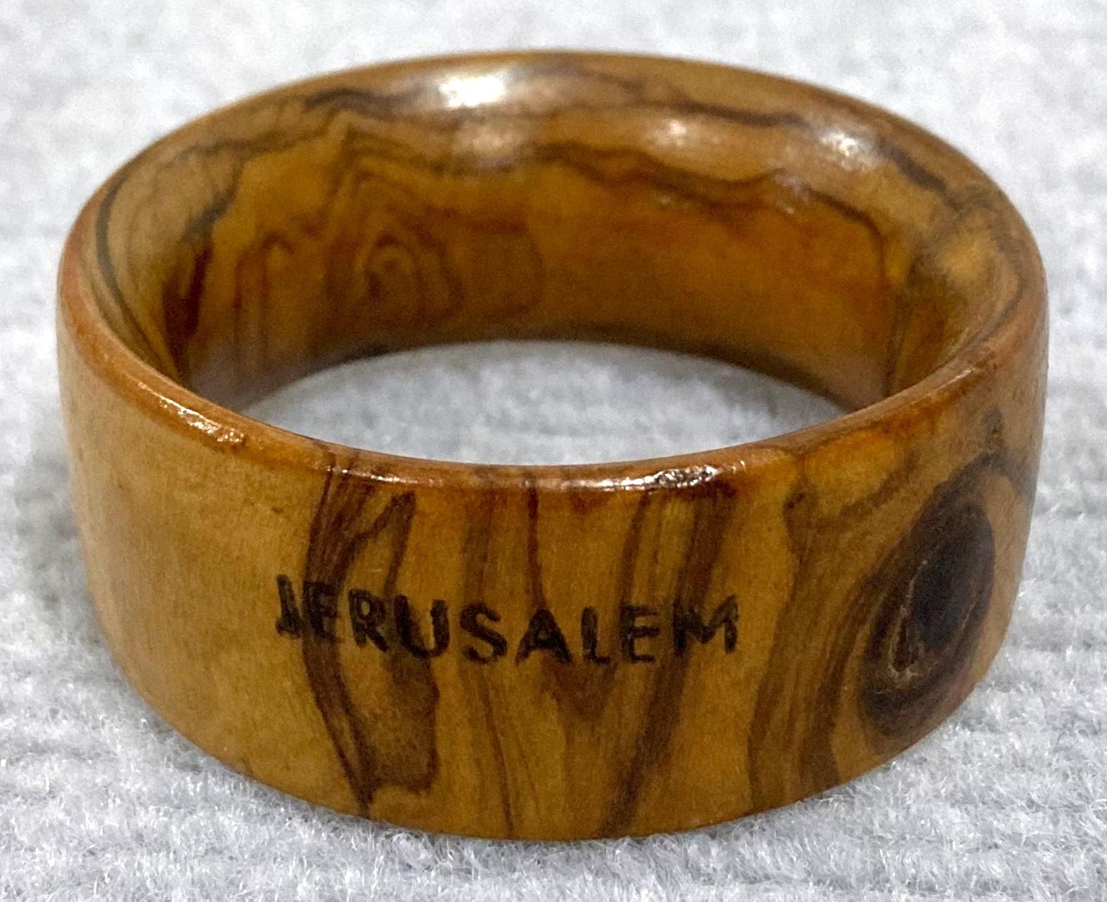 Back view of souvenir olive wood napkin ring from inside jewellery box